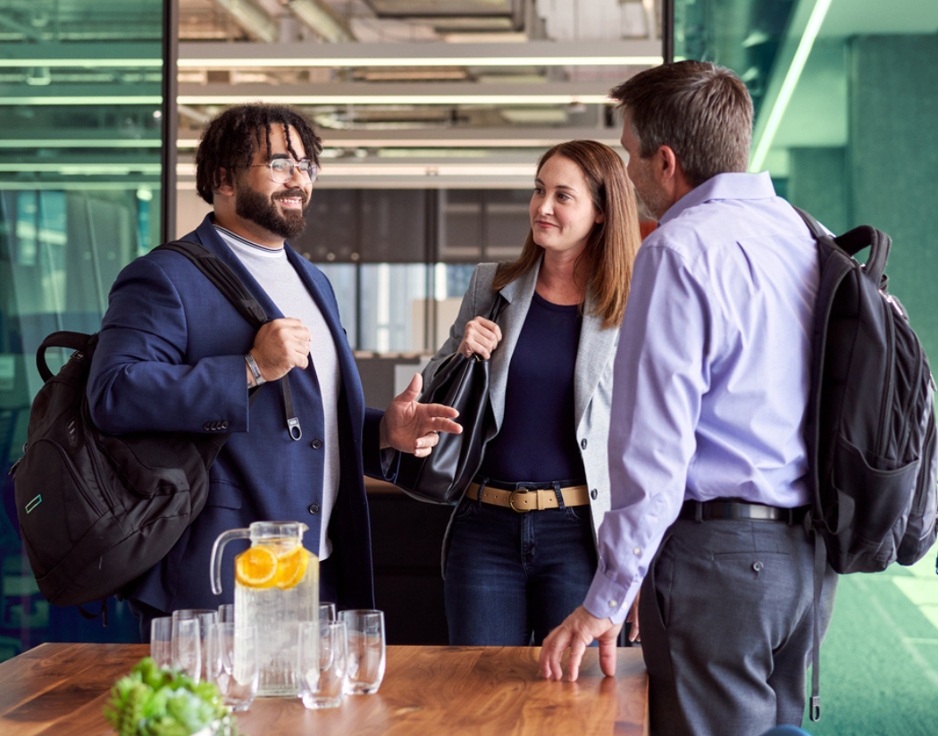 HPE team members gather and chat in a breakroom at the HPE worldwide headquarters in Spring, TX