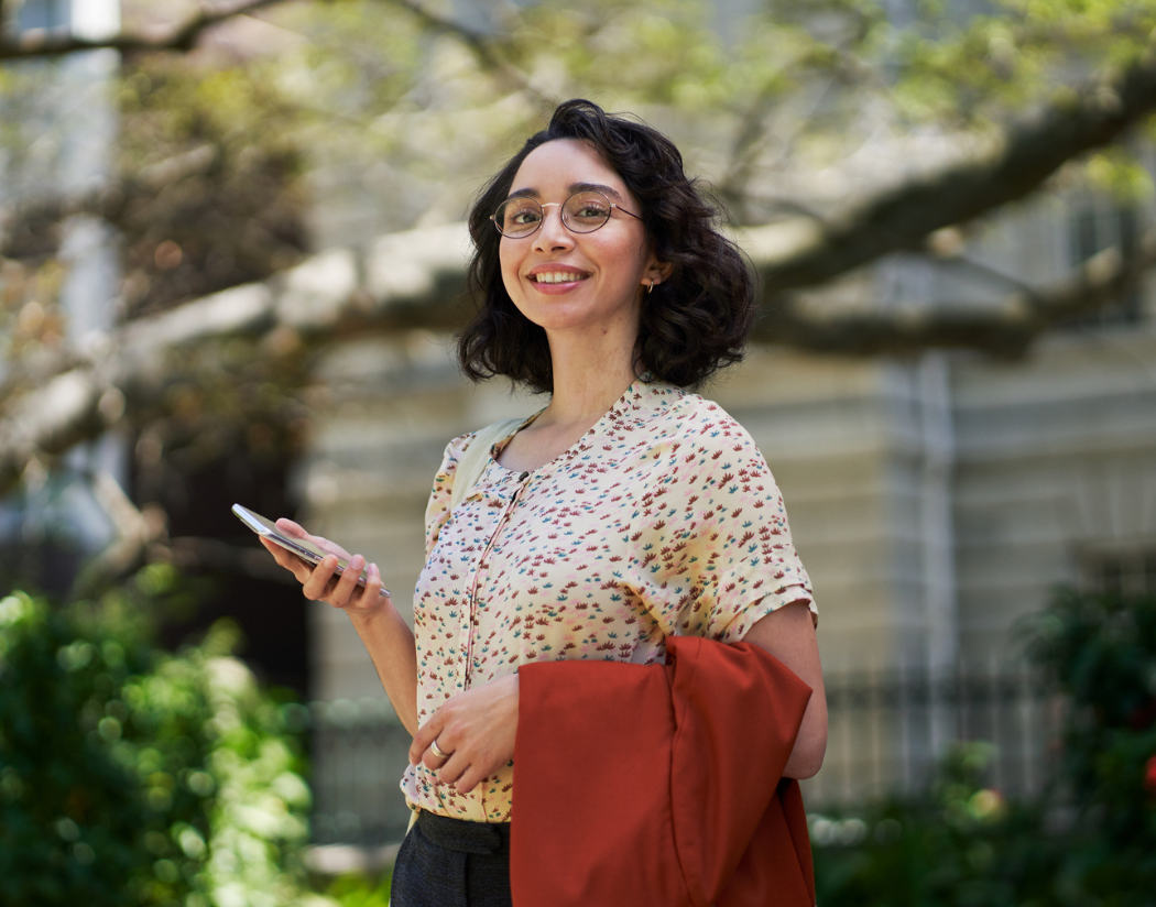 A tech professional uses her phone to join the HPE Talent Community on the go