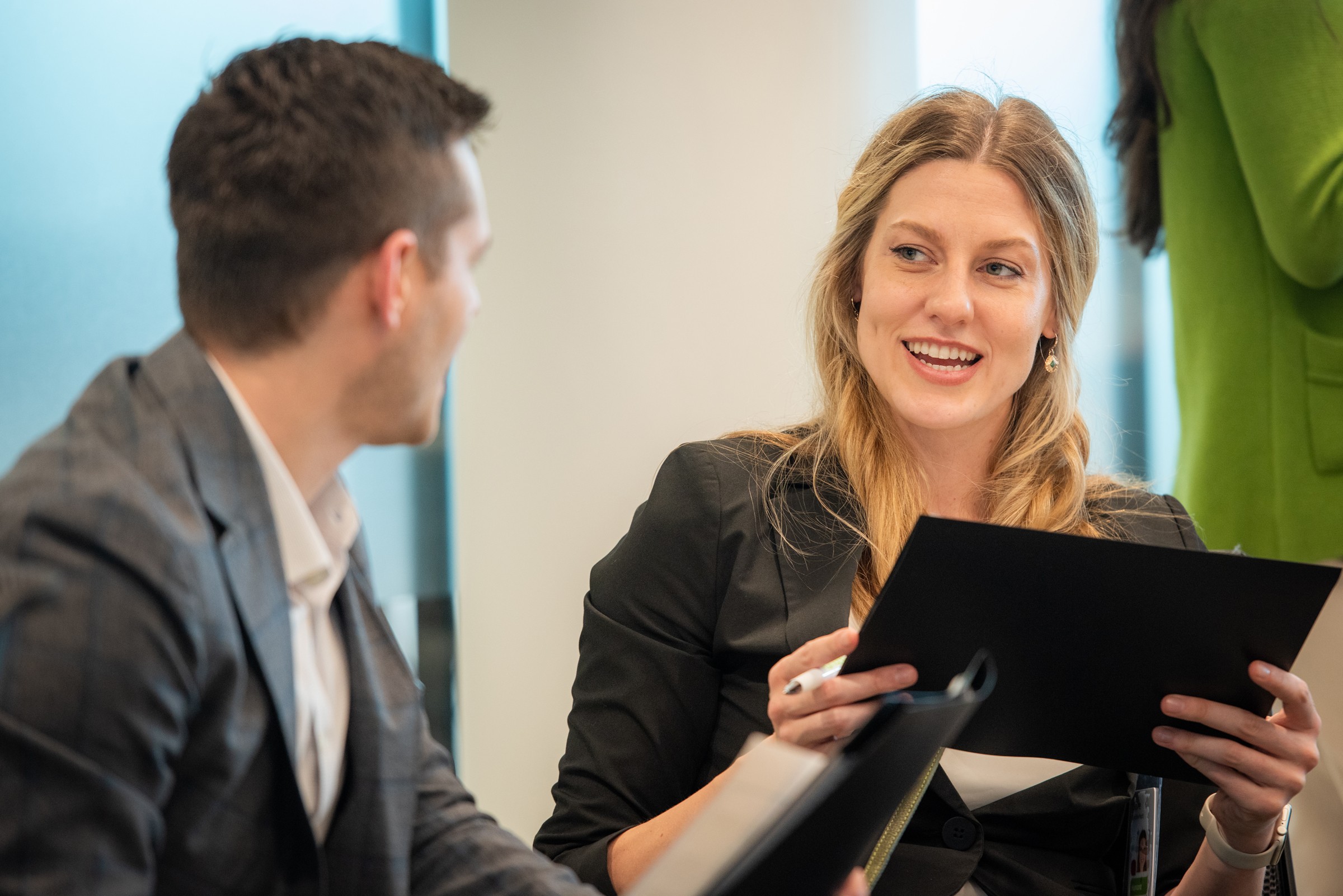 Two Humana interns sitting and collaborating in an office