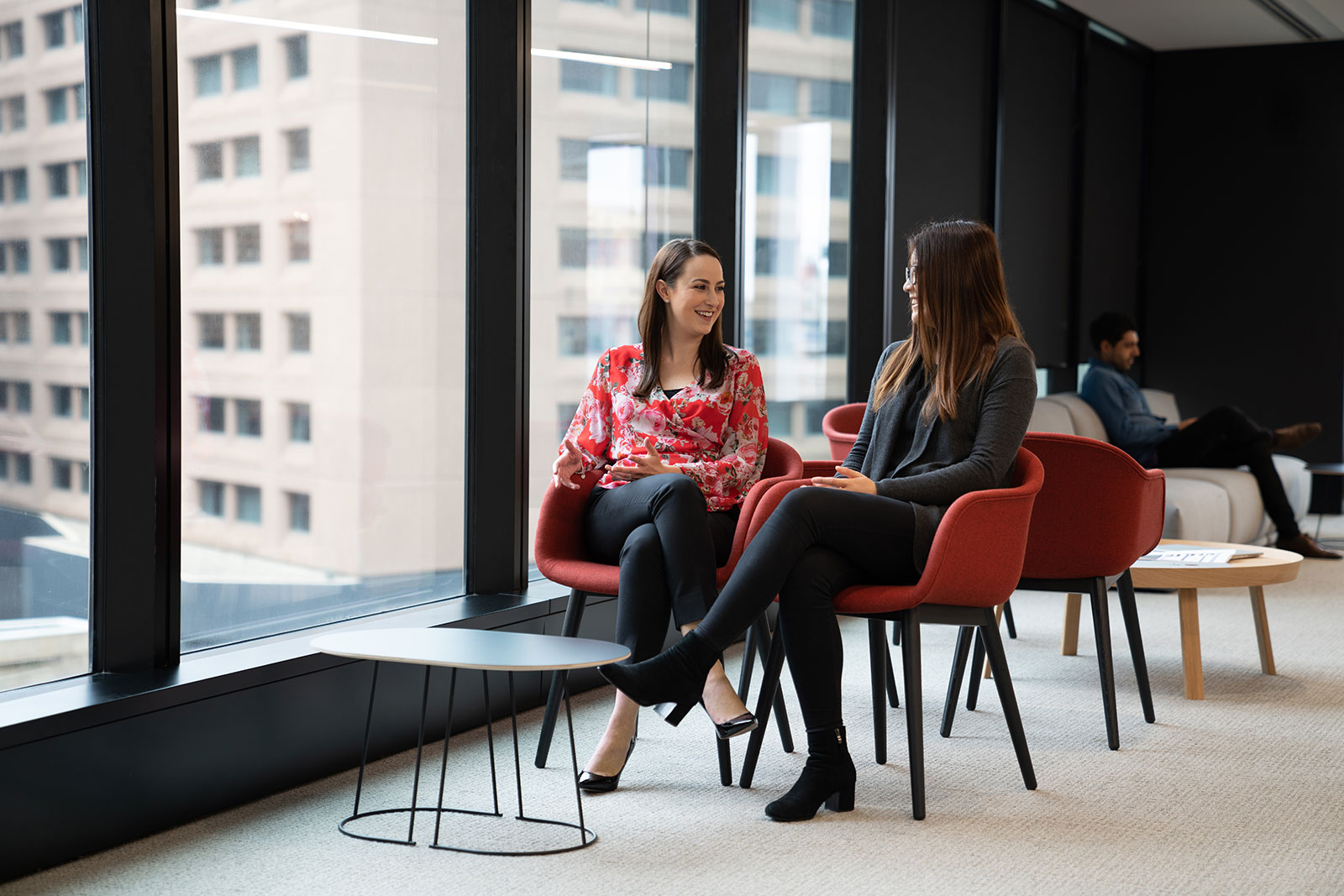 Two IAG employees having a meeting in the Sydney office