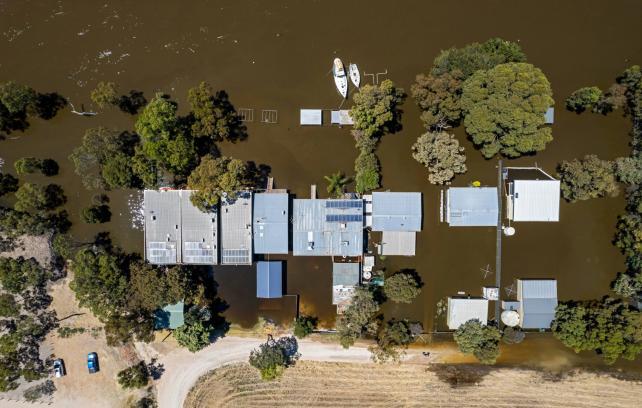 Birds-eye view of multiple houses flooded