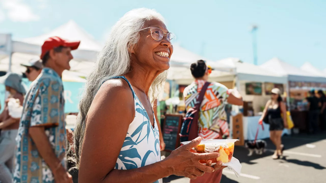 lady-eating-healthy-food-at-market