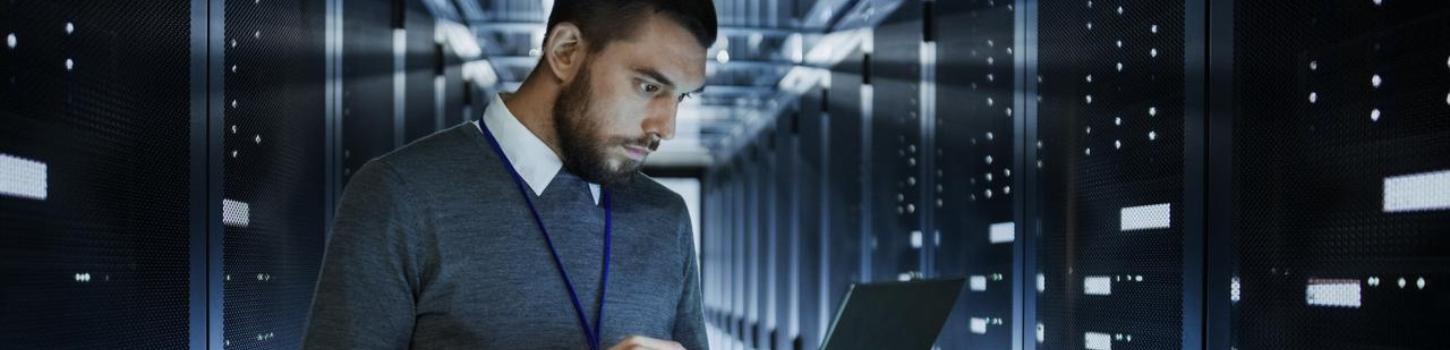 man holding a laptop