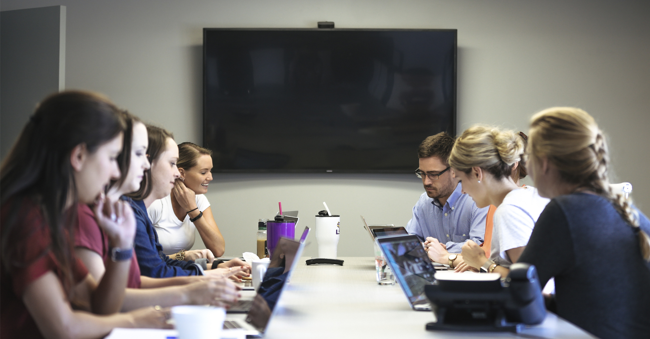 Picture of Click Here Digital team members sitting at a table