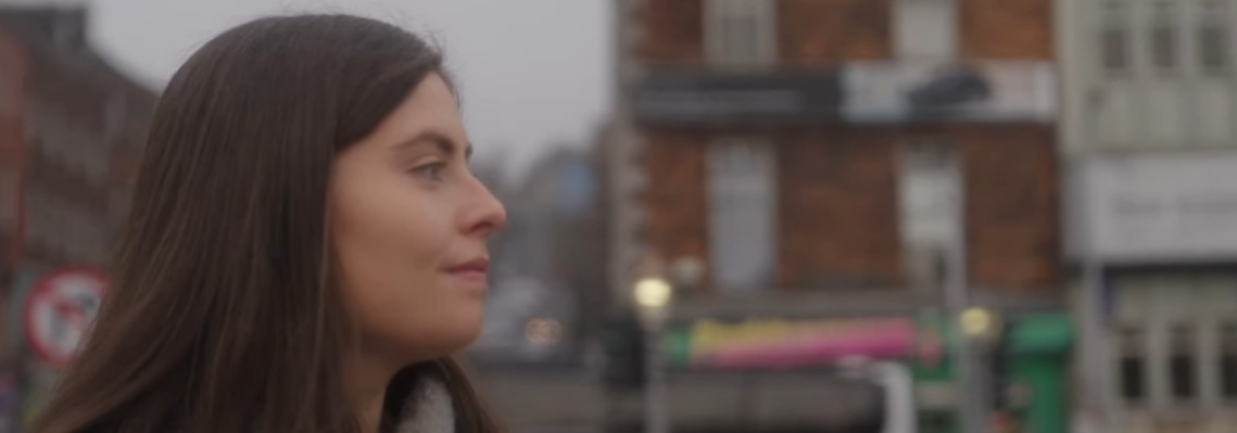 Jean, an Irish woman with brown hair looking to the right, the weather is overcast