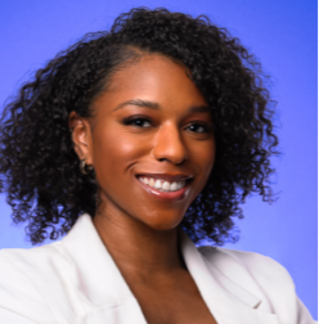 Headshot image with blue background of Ashley Mercier an African American female, smiling