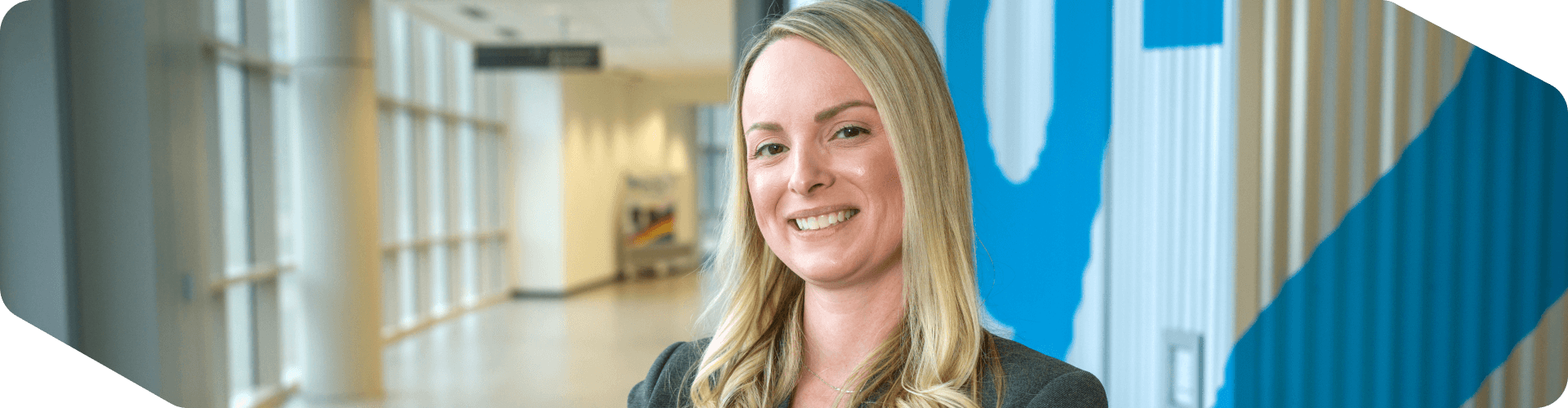 Lowe's associate standing in a hallway of Corporate Headquarters