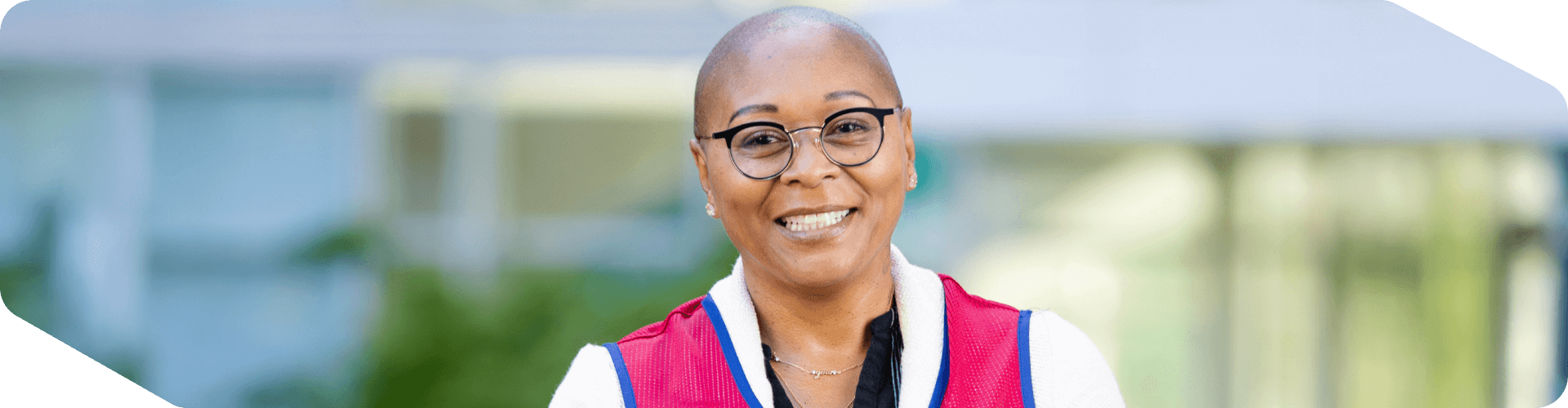 Corporate associate standing outside of corporate headquarters