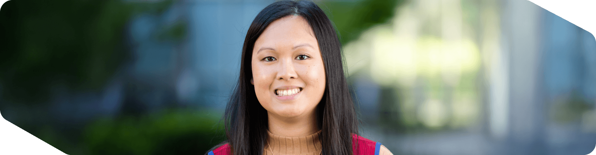 Corporate associate standing outside of corporate headquarters