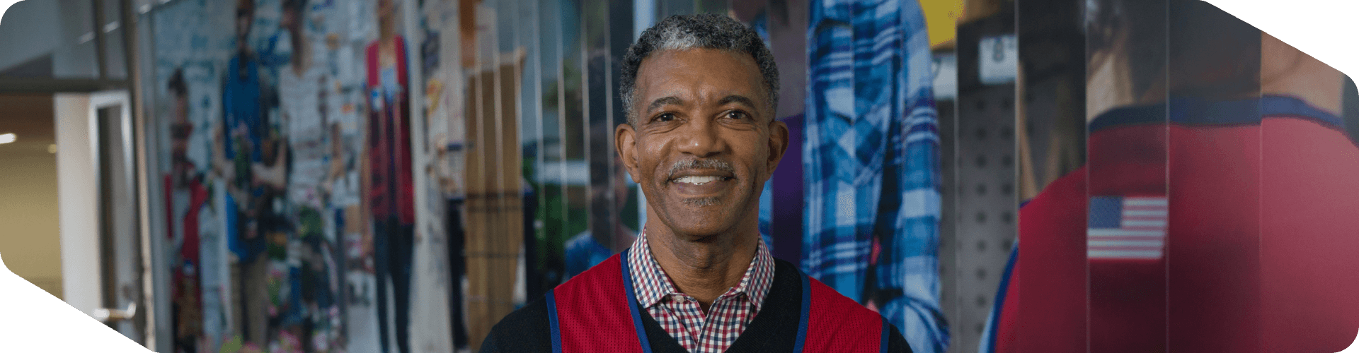 Corporate associate standing in front of a mural at corporate headquarters