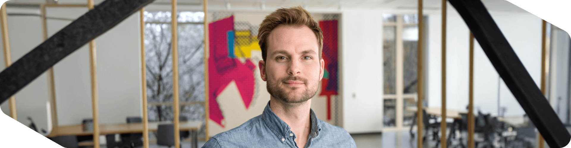 Lowe's associate standing in an open workspace at Corporate Headquarters