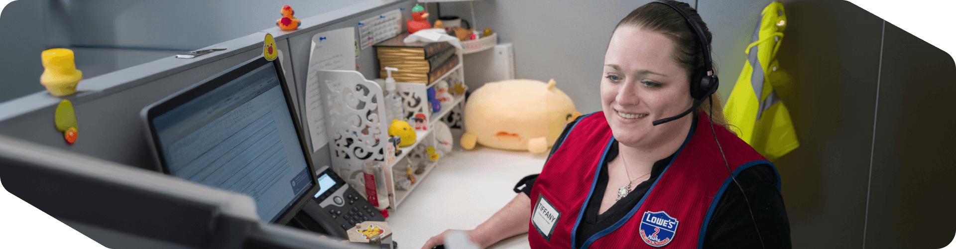 Lowe's contact center associate working at her desk