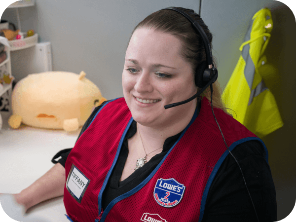 Lowe's contact center associate working at her desk