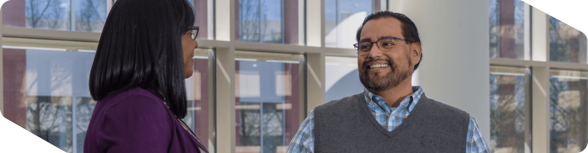 Corporate associates talking in an open area at headquarters