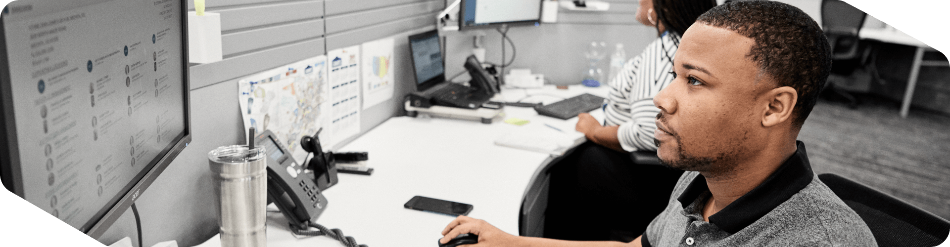 Lowe's associate working in his cubicle