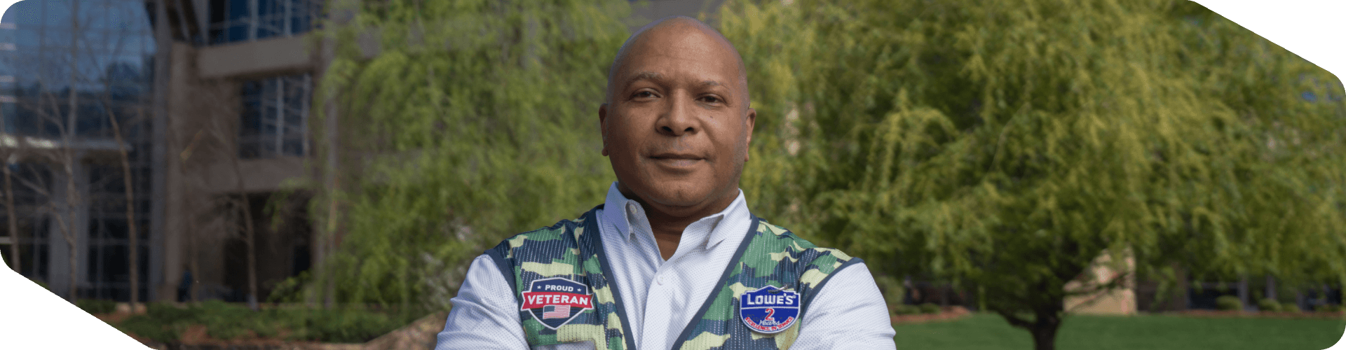 Lowe's associate and Military Veteran standing outside of corporate headquarters