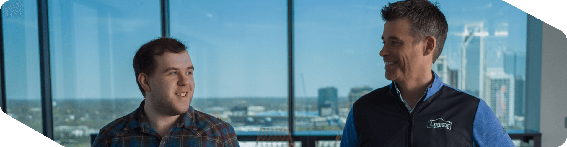 Two associates walking through the Tech Hub