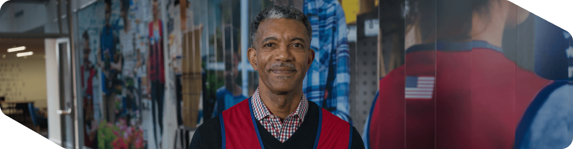 Corporate associate standing in the hallway of a Lowe's collage at headquarters