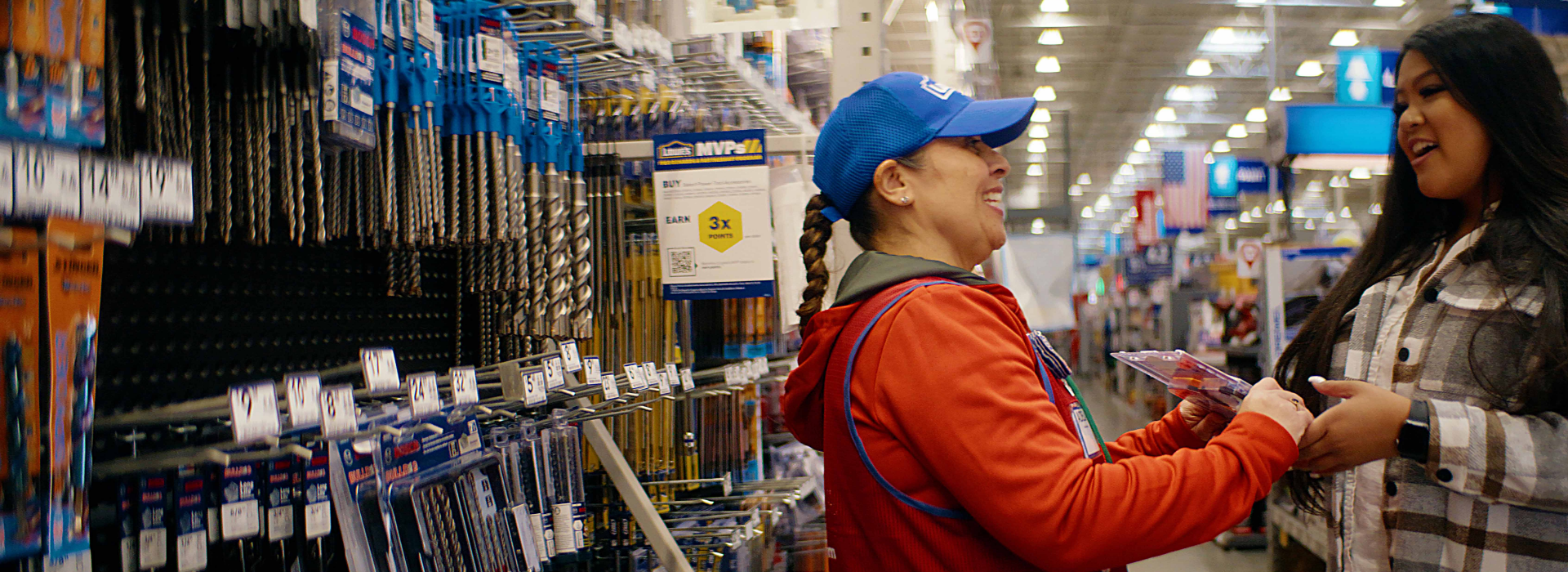 Lowe's customer service associate, Adela, assisting customer