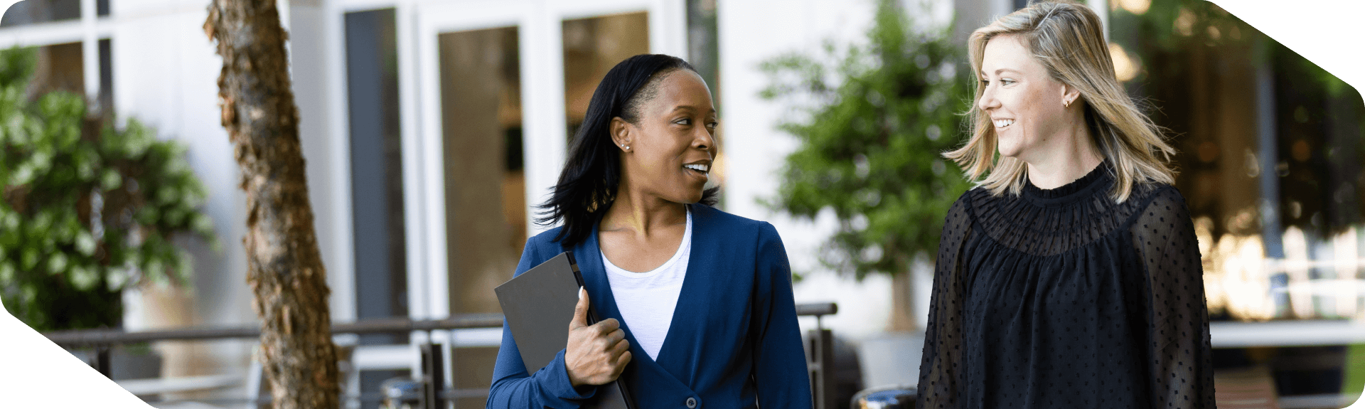 Two corporate associates walking outside at Lowe's headquarters