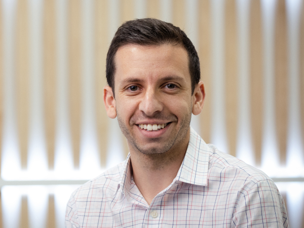 Corporate associate smiling while in a conference room