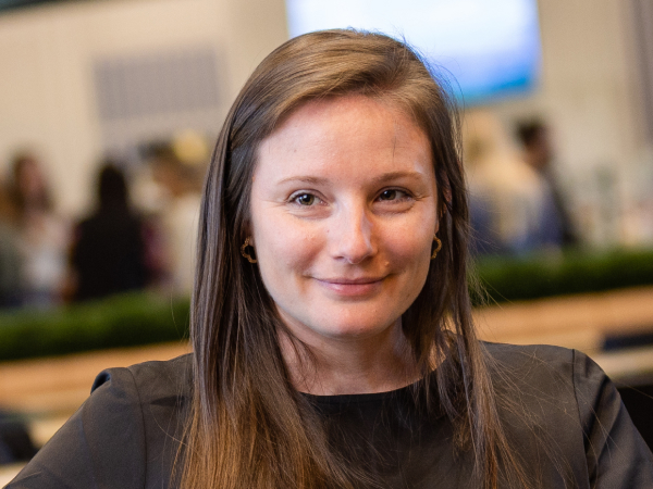 Associate smiling while working with a coworker