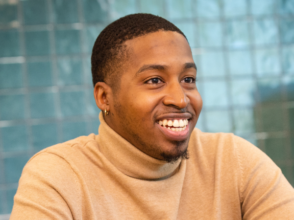 Associate smiling while talking with a coworker