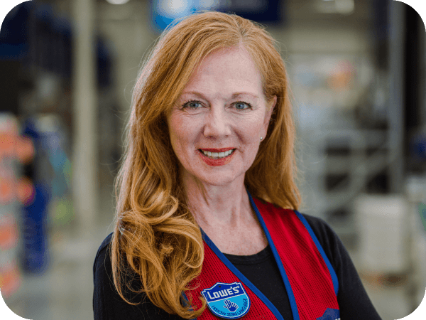 Lowe's store associate smiling confidently while working