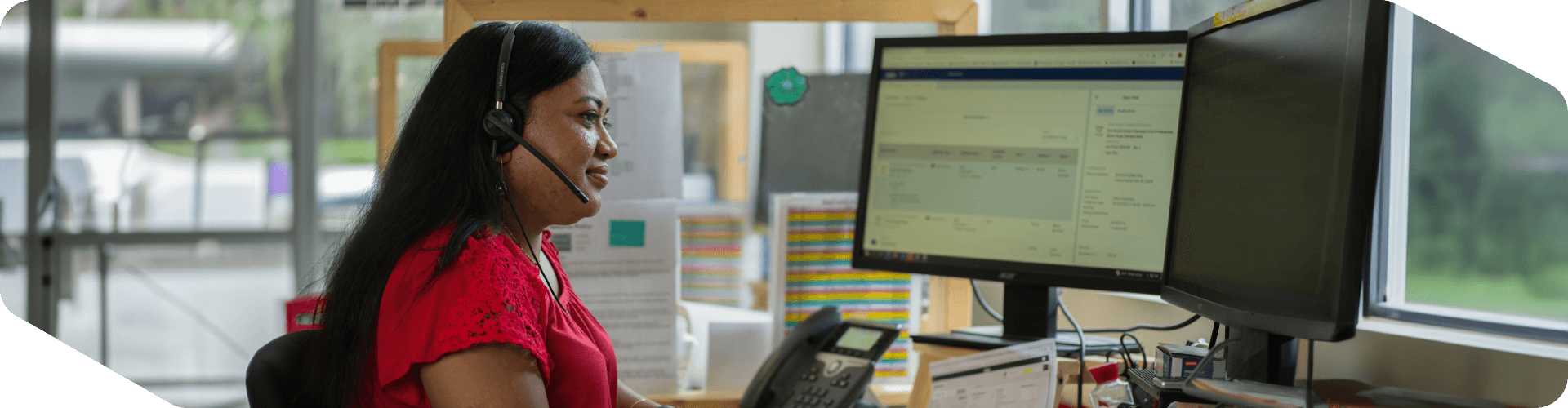 Supply Chain associate working in her office on a call