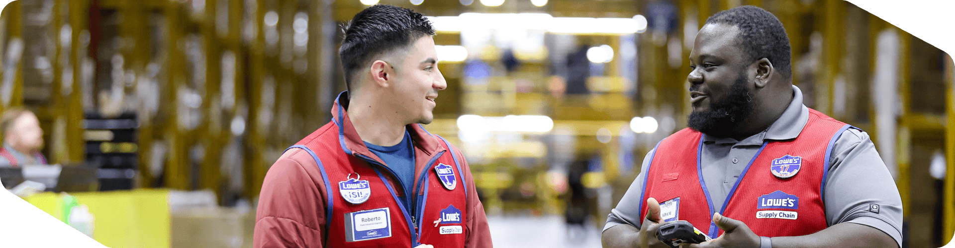 Two Lowe's Supply Chain associates working in the warehouse
