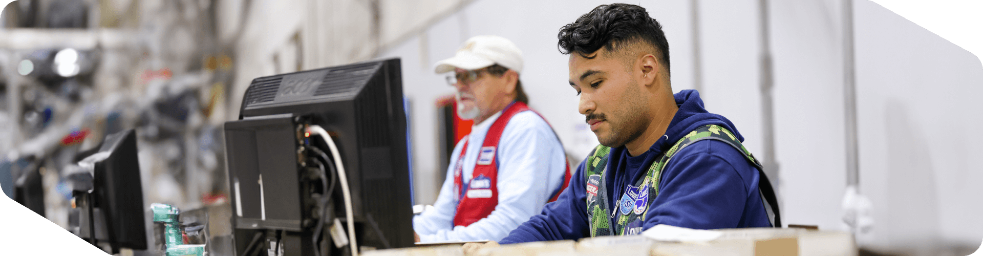 Supply Chain associates working at their computers in the distribution center