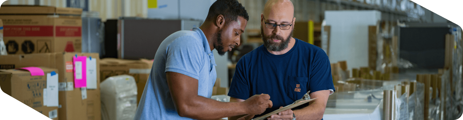 Supply Chain associate signing for a delivery
