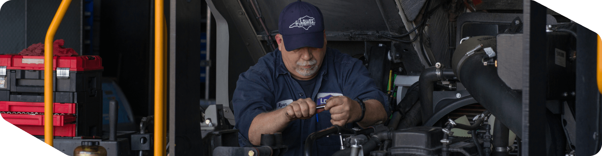 Supply Chain mechanic working on a truck