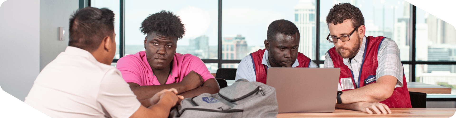 Group of Tech associates meeting to discuss work