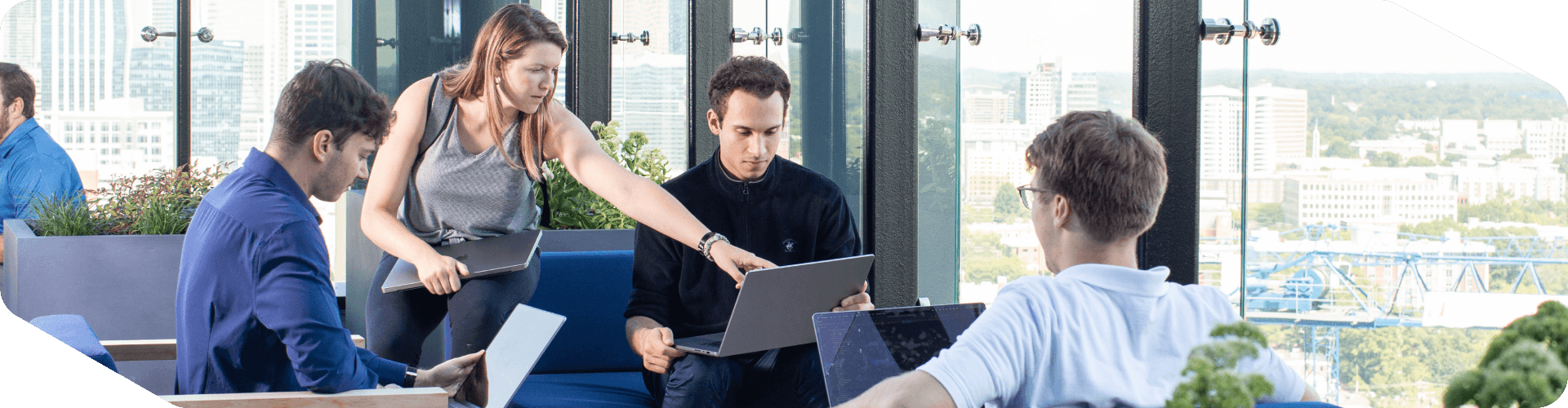 Associates working together outside at the Tech Hub