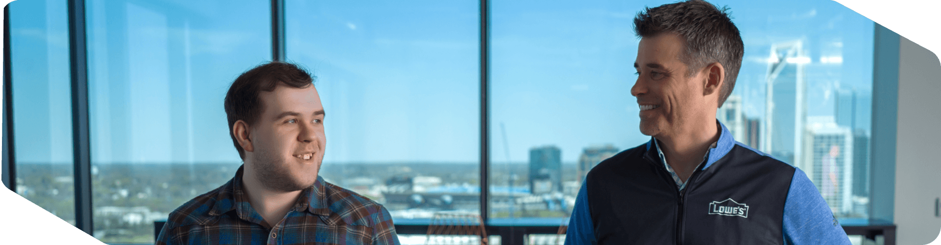 Two Tech associates walking through the Tech Hub
