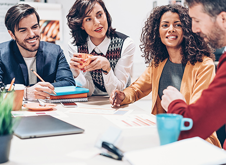 A woman presenting to a group of people