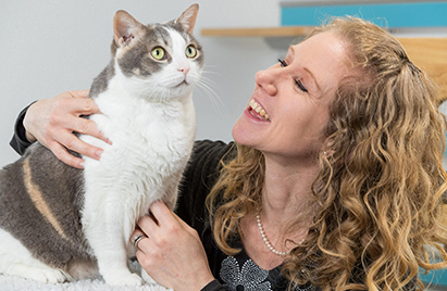 A image and headshot of a Mars Associate and their pet cat.