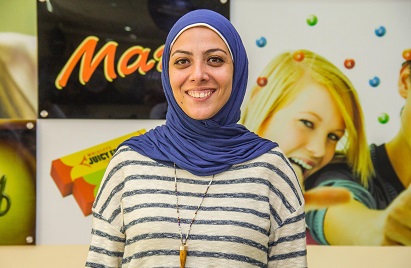 A image of a Mars Associate smiling with a Mars background