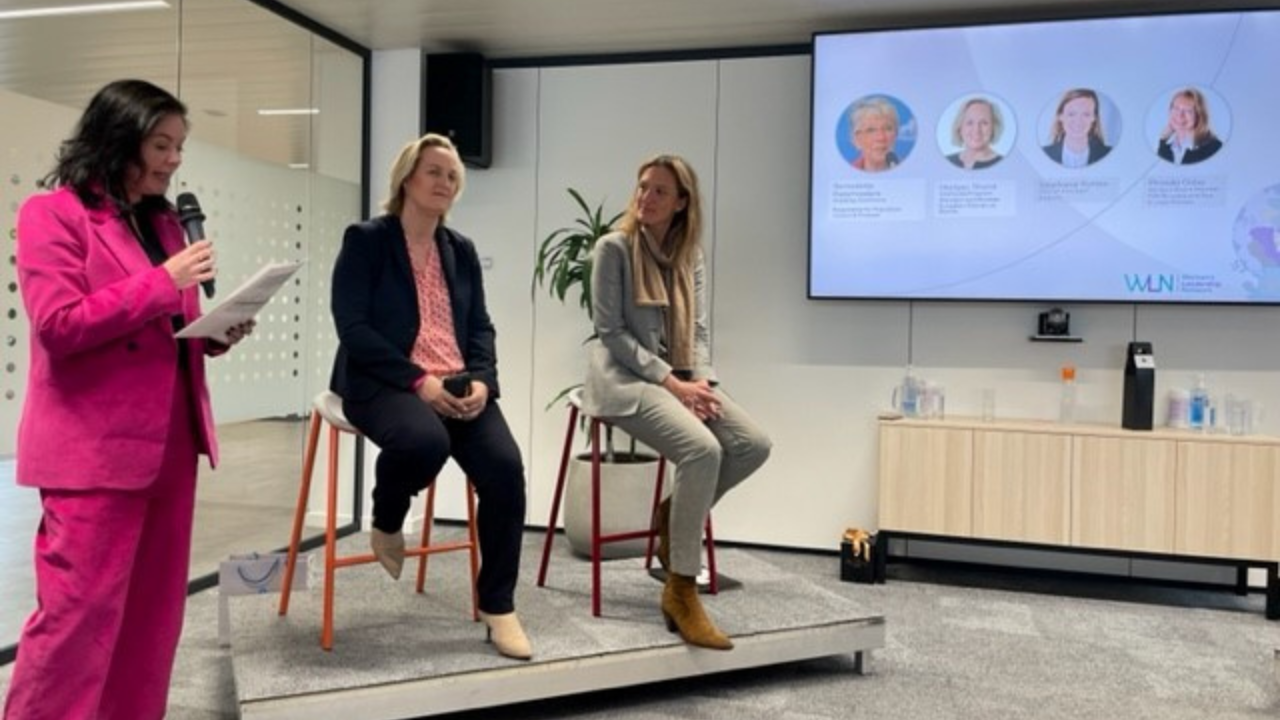 Woman smiling in the Mastercard office