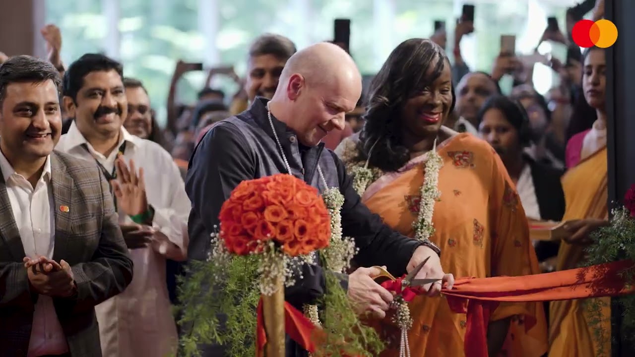 person cutting a ribbon for opening ceremony