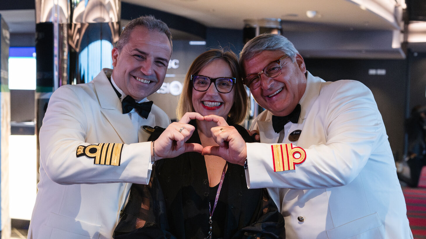 MSC Cruises onboard and ashore colleagues smiling together, representing teamwork, ambition, and achieving the extraordinary results