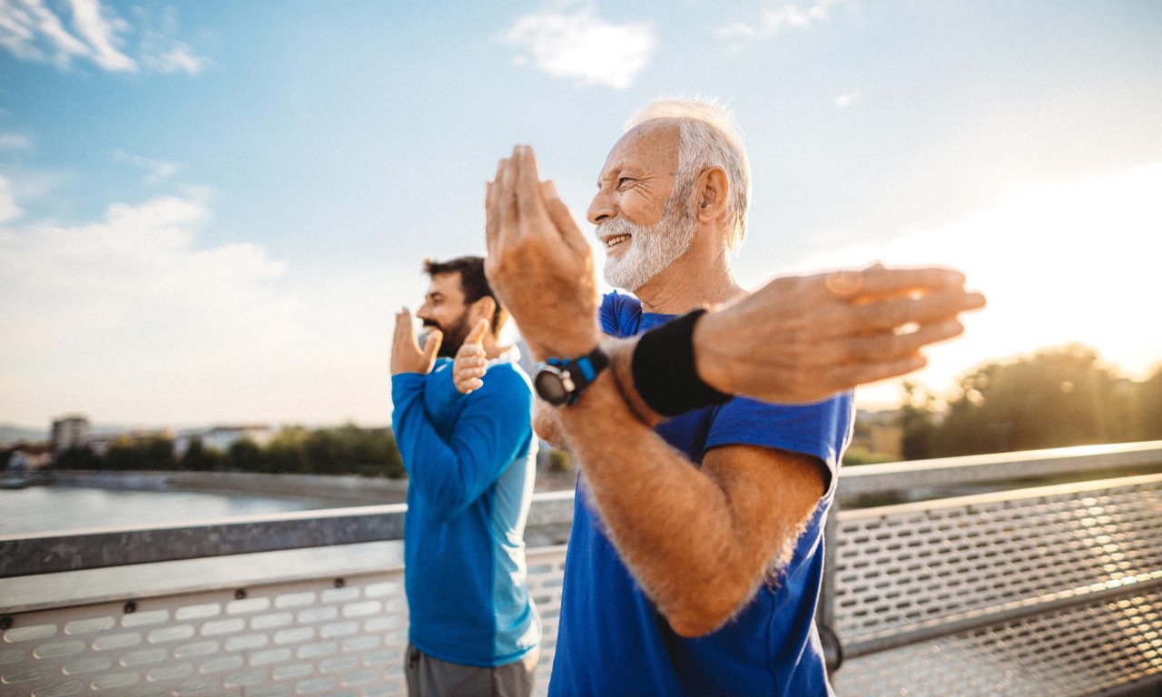 A group of men doing yoga