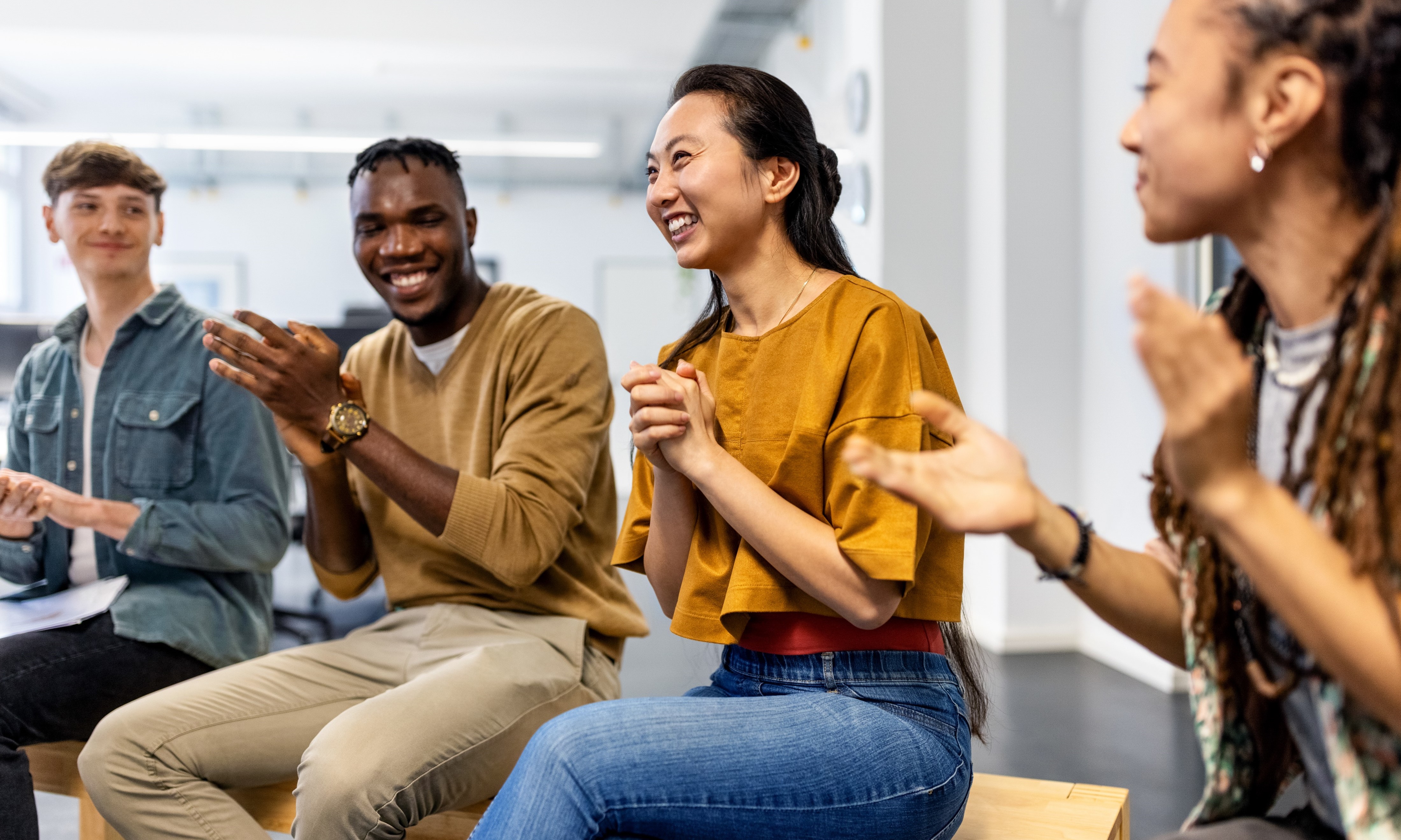 A group of people clapping