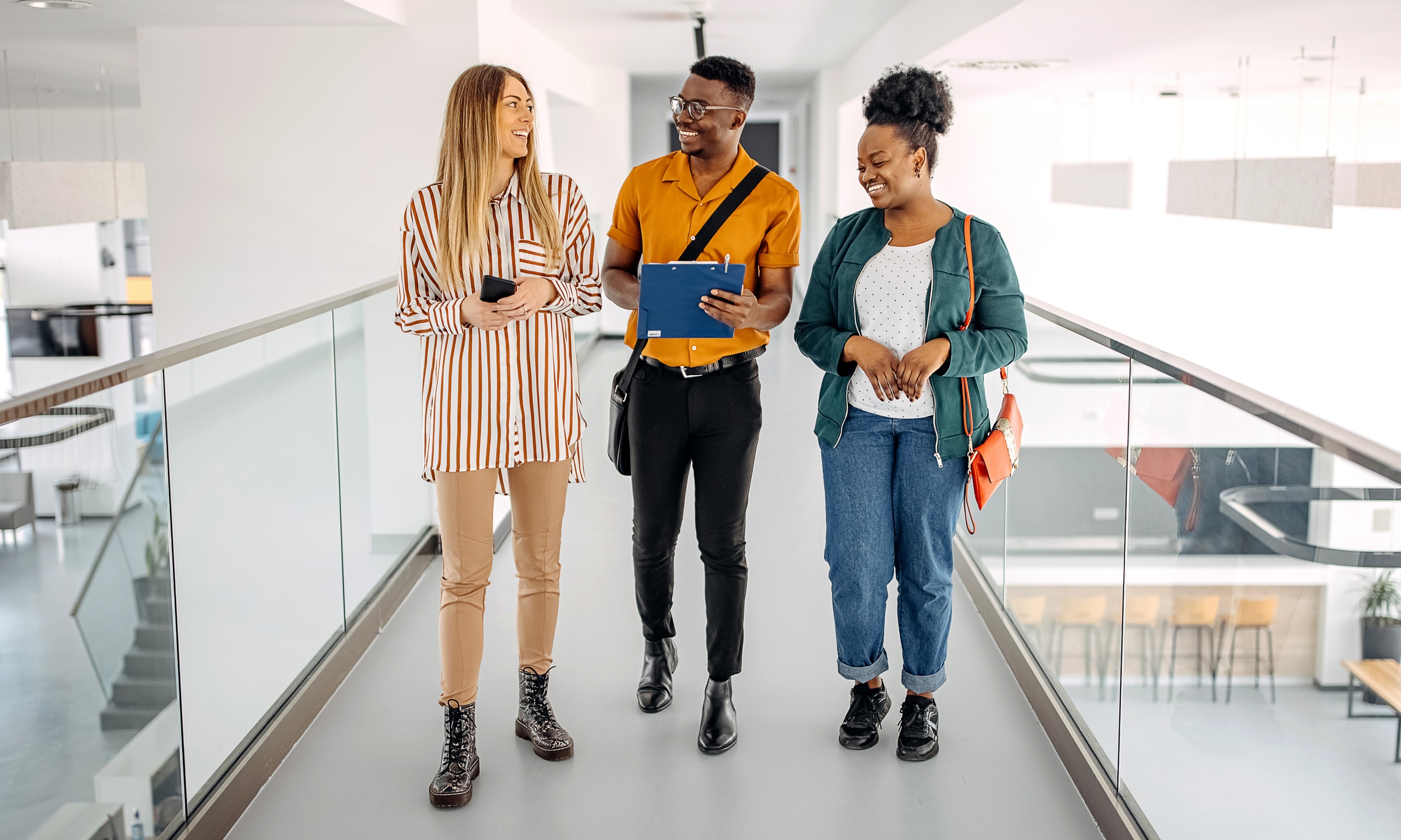 A group of people standing on a walkway