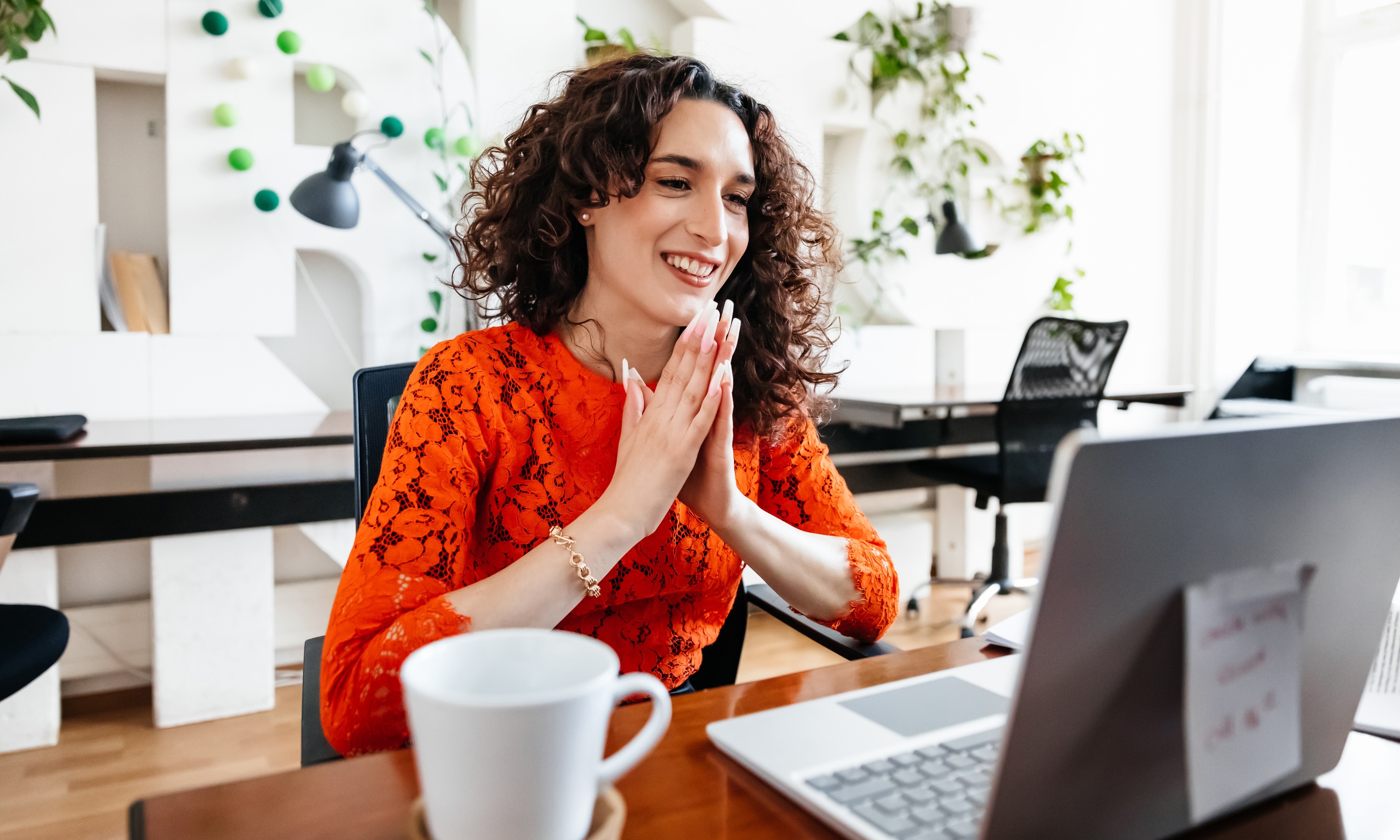 A person smiling at computer