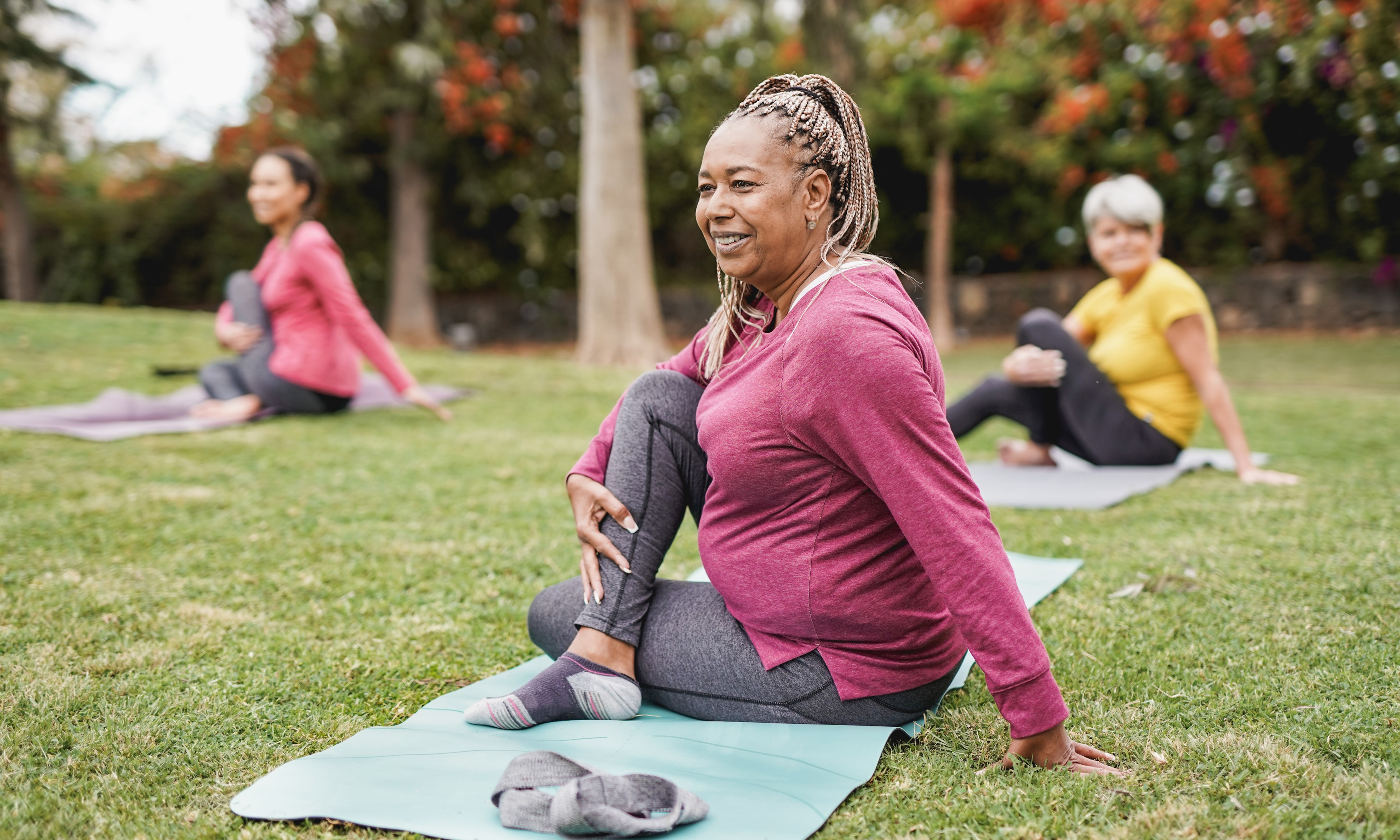 People doing yoga outside