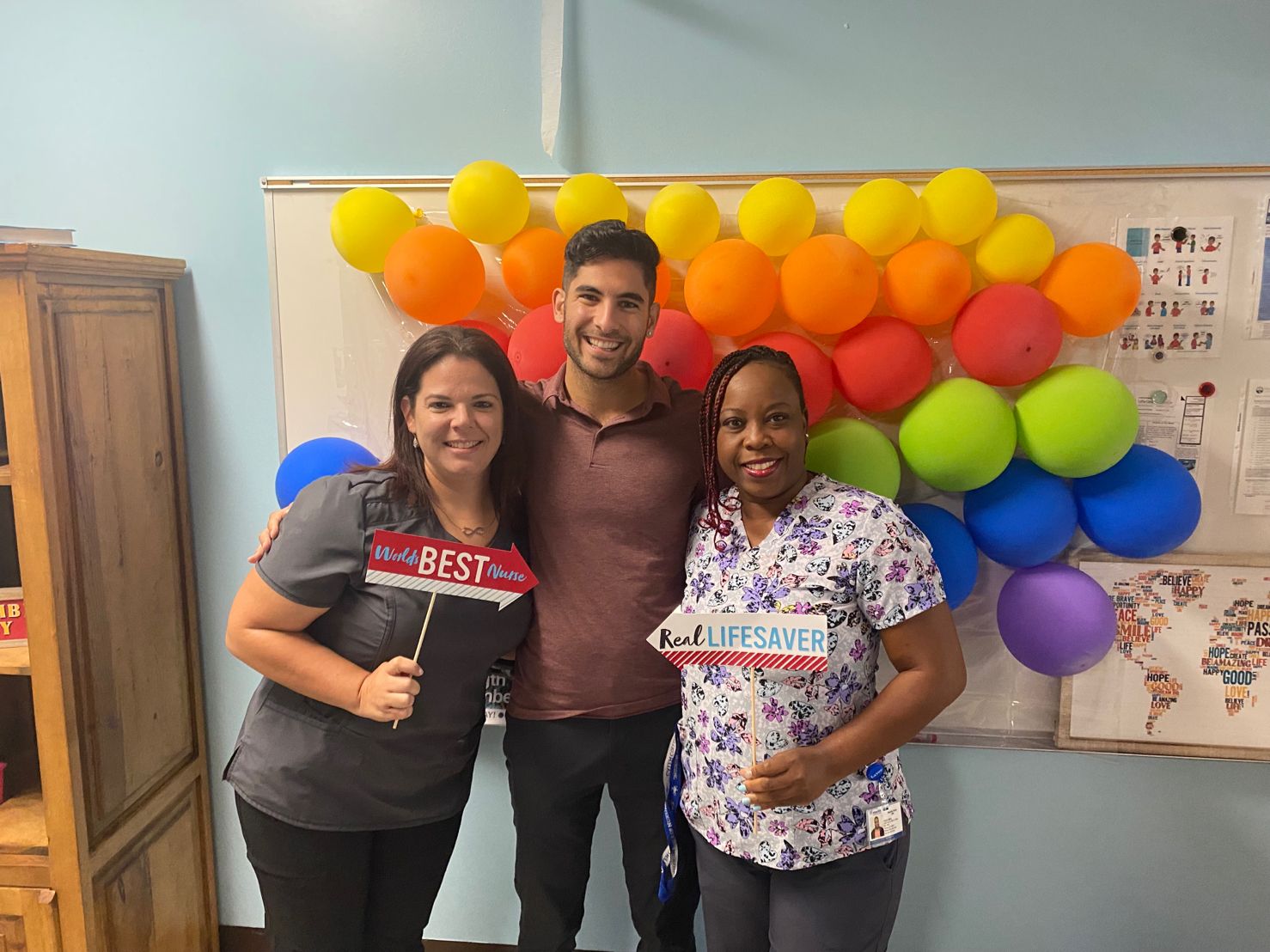 Joe P celebrating two of his nurses