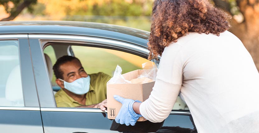 a team member giving out supplies