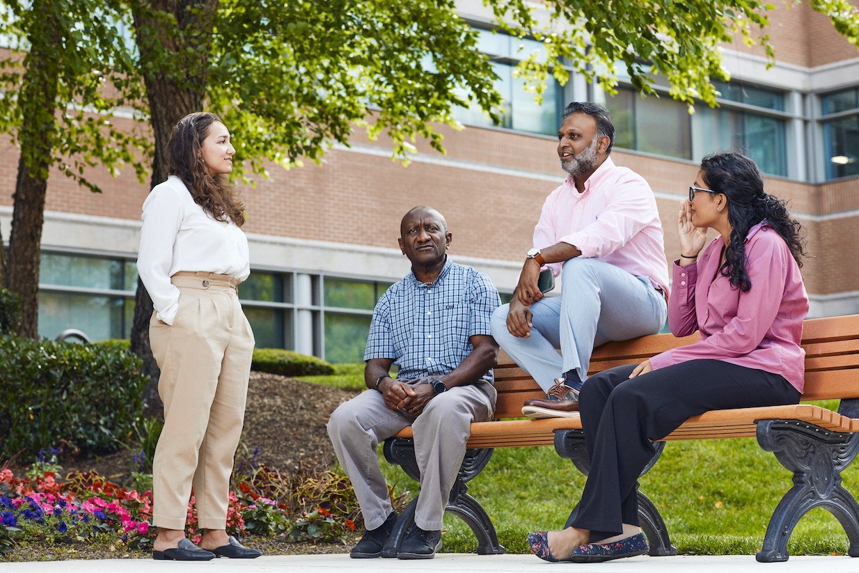 Group-chat-on-bench-outside-2_HI